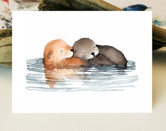 May include: Watercolor illustration of two otters floating in water. One otter is a light brown color, and the other is a dark gray. They are nestled together, with the darker otter resting its head on the other. The water is depicted with blue and gray lines.