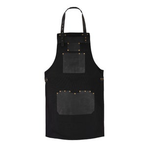 Premium black canvas apron of leather pockets and holders Perfect for chefs,bakers,butchers,BBQ. Durable stylish adjustable to fit all sizes