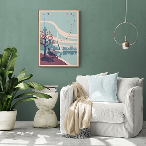 Living room with a poster or art print of an illustration of the city of Rotterdam in the Netherlands. It is a romantic scene of a couple sitting on a bench overlooking the river. Leaves drawn as hearts are flying through the sky.