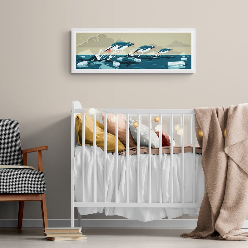 Long horizontal poster or art print hanging in a nursery with artwork of three gentoo penguins that are making speed between the ice floes in the ocean around Antarctica. The panorama has shades of beige, white and blue colors.