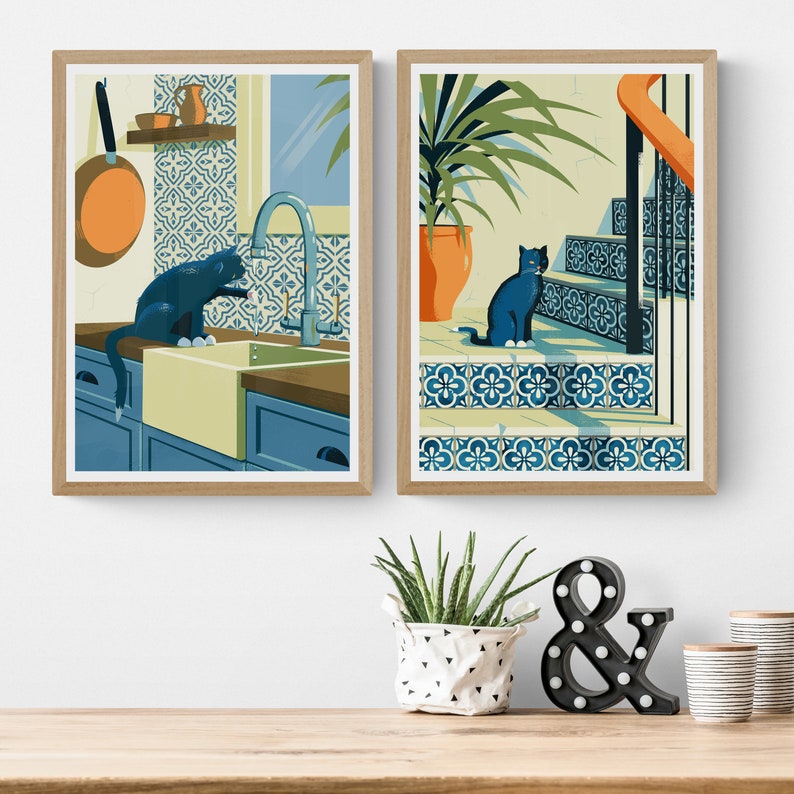 Living room with 2 posters on the wall. The illustrations on the art print shows a black cat with azulejo tiles as can often be found in Spain and Portugal. The artwork gives a Mediterranean feel.