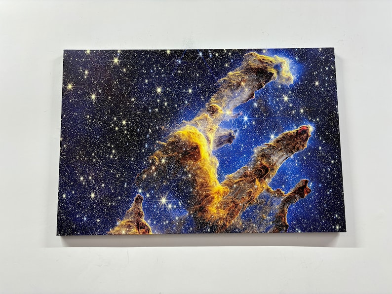 May include: A vibrant, colorful nebula with swirling clouds of gas and dust, illuminated by bright stars. The nebula is a deep blue color with streaks of gold and orange.