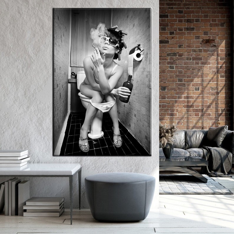May include: Black and white art print of a person sitting on a toilet, smoking a cigarette, and holding a bottle. The person is wearing sunglasses, curlers, and sandals. The background is a bathroom.