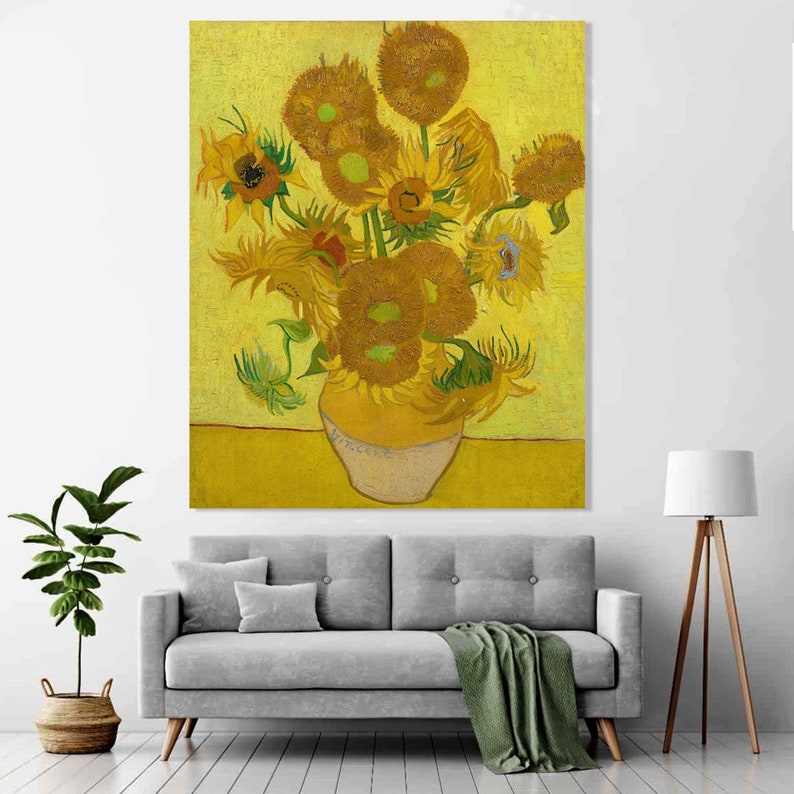 May include: A painting of a vase filled with sunflowers. The sunflowers are yellow with brown centers and are arranged in a loose, natural way. The vase is a simple, white ceramic vase with a yellow base. The background is a bright yellow.