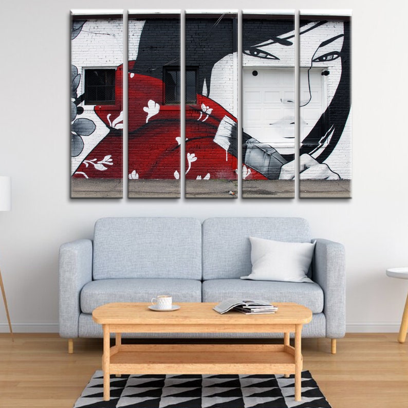 May include: A five-piece canvas print set featuring a black and white graffiti mural of a woman's face with red and white floral details on a brick wall.