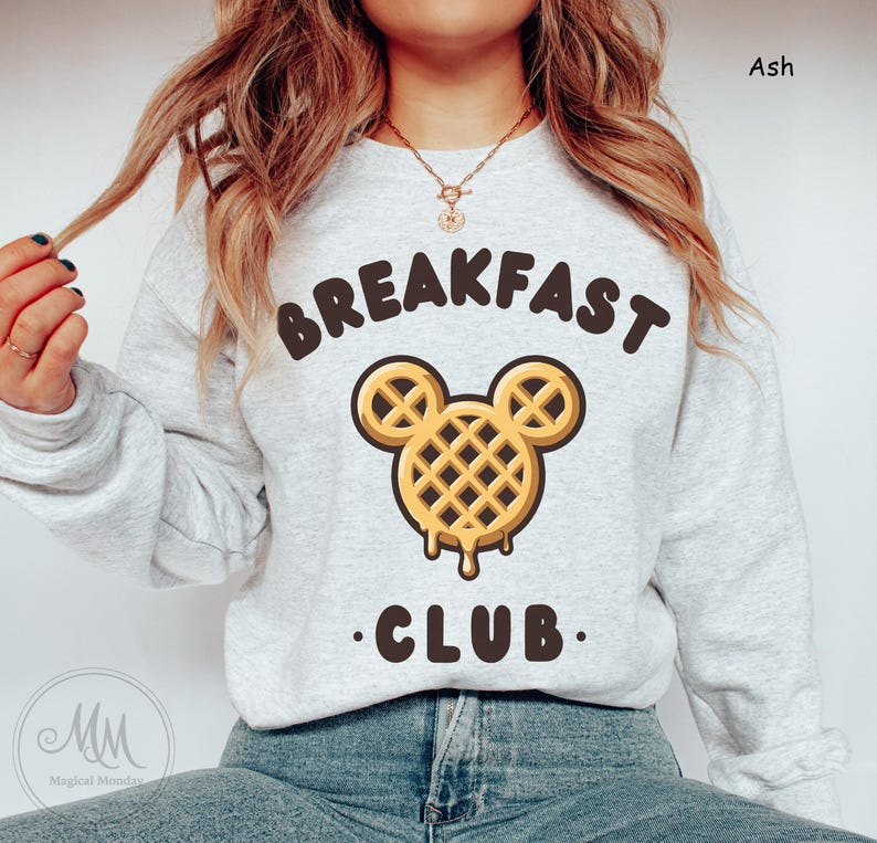 May include: A gray sweatshirt with the text "Breakfast Club" and a waffle Mickey Mouse graphic.
