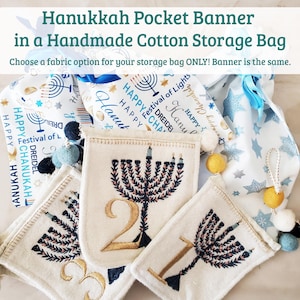 Bandera de bolsillo de fieltro para Hanukkah en bolsa de regalo de algodón hecha a mano. Bolsillos de fieltro bordados con pompones amarillos y azules, y cordel dorado y crema.