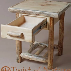 May include: A rustic wooden end table with a single drawer and a lower shelf. The table is made of natural wood with a light brown finish. The drawer is open and the shelf is visible. The table is labeled "Twist of Nature" and "Hand Crafted Log Furniture".