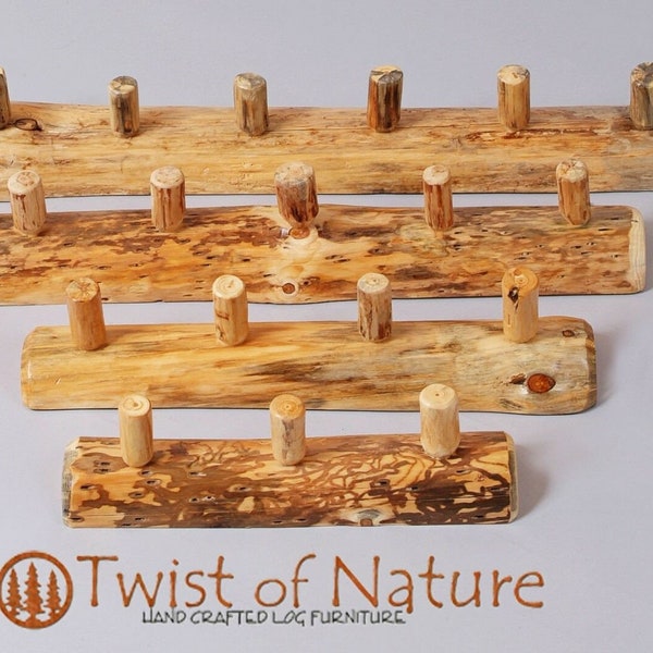 Half log coat rack ! Beautiful and rustic! Choose the number of pegs.Half log base is 4" diameter and pegs stick out 3"