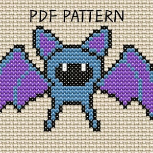 Puede incluir: Un patrón de punto de cruz sobre tela Aida beige con un diseño de murciélago pixelado. El murciélago es azul claro con alas y orejas moradas, cara negra y ojos blancos. El texto PDF PATTERN aparece impreso en negro en la parte superior.