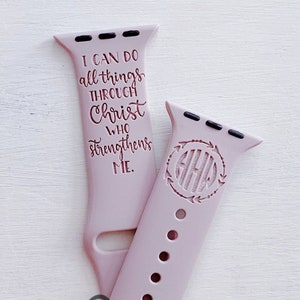 May include: A pink silicone Apple Watch band with the text "I can do all things through Christ who strengthens me." and a monogrammed initial "A" on the other side. The band is engraved with "love engraved LLC".
