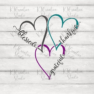 May include: Three overlapping hearts with the words "blessed", "thankful", and "grateful" written inside them. The hearts are in shades of teal, purple, and gray.