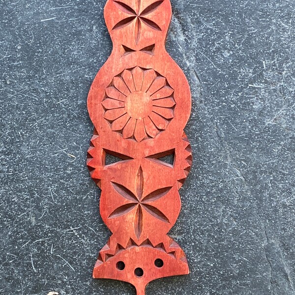 Hand-carved spinning wall ornament from Finland