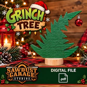 May include: A green wooden Christmas tree cutout with a textured finish, mounted on a round light wood base. A single red ornament hangs from the top branch. The text reads Grinch Tree and Sawdust Garage Studios Digital File .pdf.