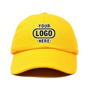 May include: A yellow baseball cap with black text that reads "YOUR LOGO HERE" in a rounded rectangle.