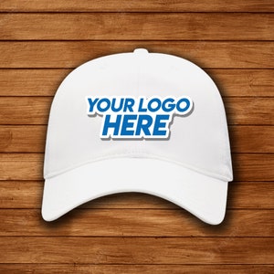 May include: White baseball cap with a blue "YOUR LOGO HERE" text on the front.