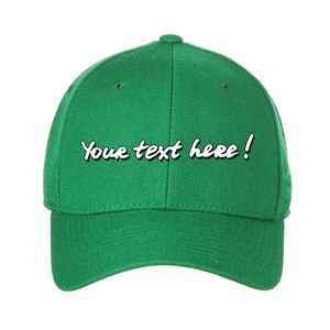 May include: A green baseball cap with the text "Your text here!" embroidered on the front.