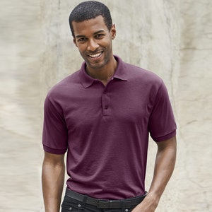 May include: A burgundy short-sleeved polo shirt with a button-up collar.