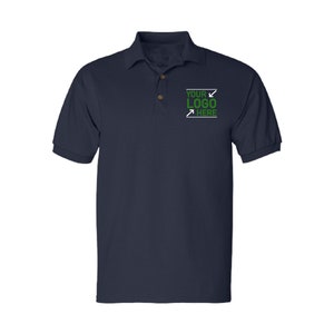 May include: A navy blue polo shirt with a white button placket and a green embroidered logo that says "YOUR LOGO HERE".