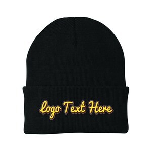 May include: Black knit beanie with a yellow embroidered logo that says "Logo Text Here".