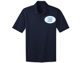 May include: Navy blue polo shirt with short sleeves. The shirt features a collared neckline and a three-button placket. An oval patch on the chest displays the text "YOUR LOGO HERE" in a blue outline.