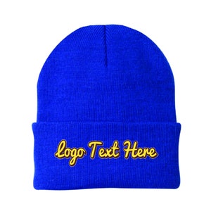 May include: A blue knit beanie with a yellow embroidered logo that says "Logo Text Here".