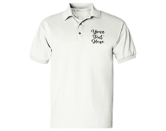 May include: White short-sleeved polo shirt with a button-down collar and a small embroidered design on the left chest that says "Your Text Here".