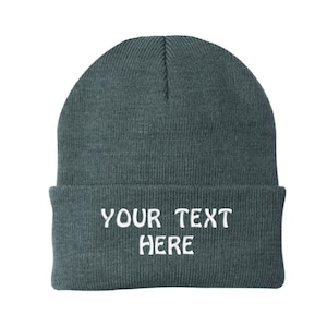 May include: A gray beanie with the text "YOUR TEXT HERE" embroidered in white on the front.