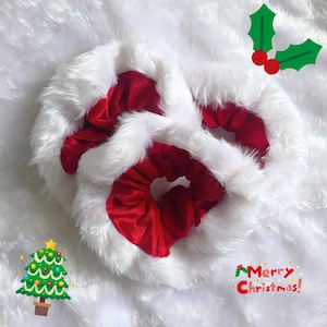 May include: Three Christmas-themed scrunchies. Each scrunchie features a red velvet center, surrounded by a fluffy white faux fur trim. The image includes a Christmas tree graphic and the text "Merry Christmas!"