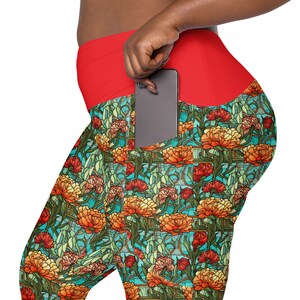 May include: Red and teal patterned leggings with a large pocket on the right side. The pocket is designed to hold a phone.
