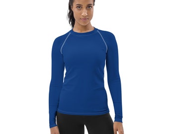 May include: A royal blue long-sleeved shirt with a crew neck and white stitching around the neckline and shoulders.