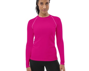 May include: A long-sleeved shirt in a bright pink color. The shirt has a crew neck and a fitted silhouette.