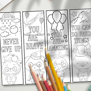 May include: A set of four vertical coloring bookmarks featuring black and white line art. The designs include a hedgehog with the text NEVER GIVE UP, a character with an airplane and the text YOU ARE BRAVE, balloons with the text YOU ARE AMAZING, and a bird with the text YOU CAN DO HARD THINGS.