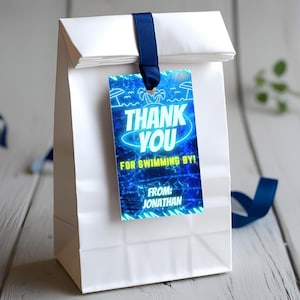 May include: Blue and yellow thank you tag with a neon glow effect. The tag says "Thank You for Swimming By!" and "From: Jonathan".