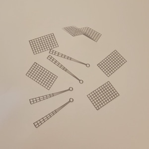 May include: A set of six gray mesh panels and three gray mesh rods. The panels are rectangular and the rods are long and thin.