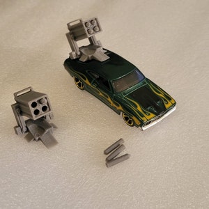 Lanzamisiles a escala 1/64. Impresión 3D. 2 piezas. No incluye coche. Misiles desmontables.