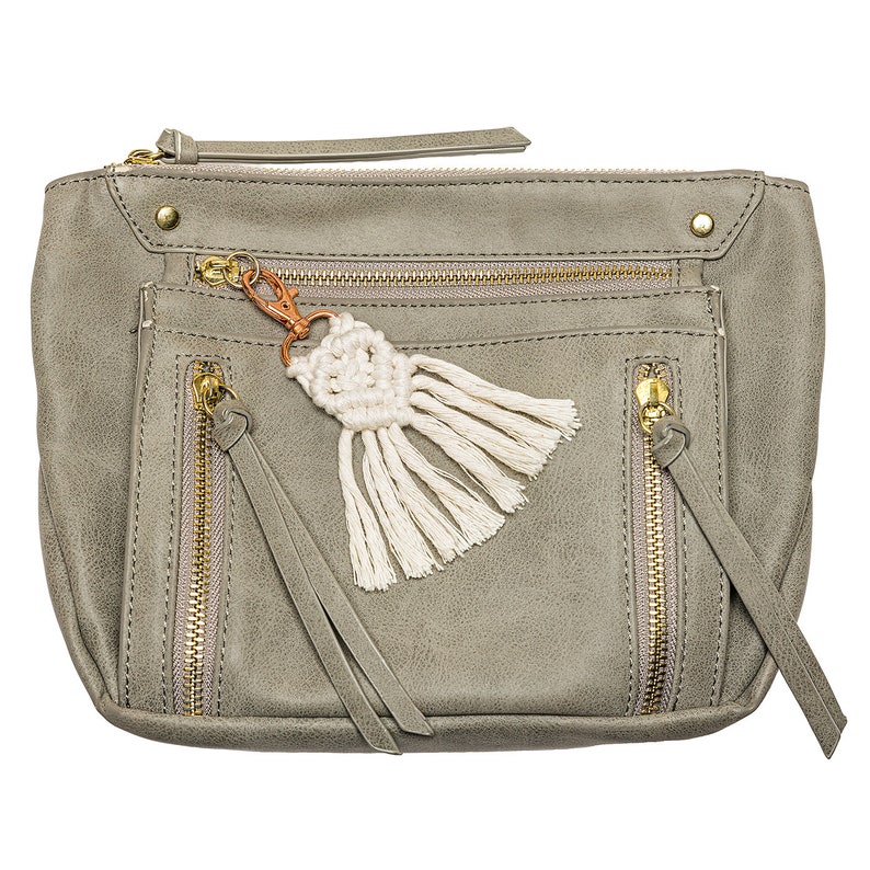 May include: A gray faux leather zippered pouch with a white tassel keychain. The pouch has multiple zippered compartments and a gold zipper.