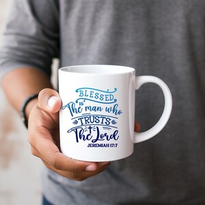 May include: White ceramic mug with a blue and white design that says "Blessed is the man who trusts the Lord" and "Jeremiah 17:7".