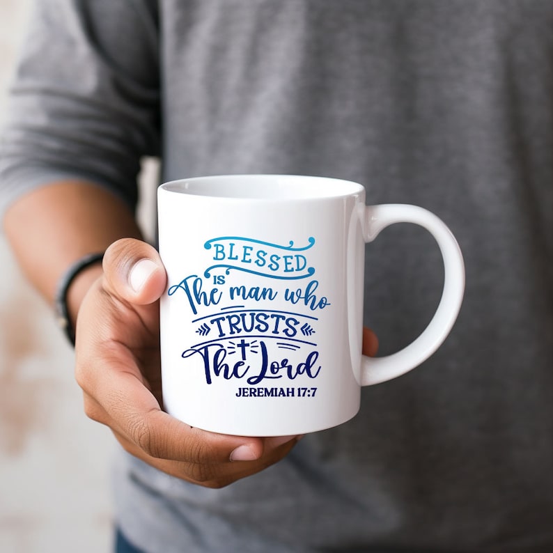 May include: White ceramic mug with a blue and white design that says "Blessed is the man who trusts the Lord" and "Jeremiah 17:7".