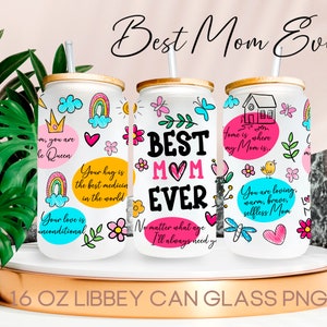 May include: Three 16 ounce white glass can tumblers with gold lids and straws. Each tumbler has a different design with colorful doodles and text. The text on the tumblers reads "Best Mom Ever", "Your hug is the best medicine in the world", and "Home is where my Mom is".