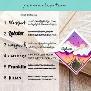 May include: A diamond-shaped bookmark featuring a sunset and night sky design with clouds and the name Stephanie printed on a white cloud. The image displays a list of six font options labeled BlackJack, Lobster, HoneyQuick, Caeldera, Franklin, and Julian.
