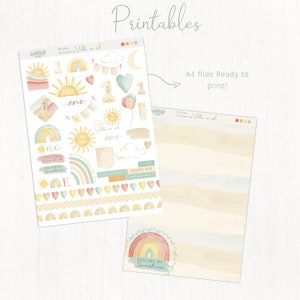May include: Printable stickers featuring a rainbow, sun, clouds, hearts, and the text "You are my sunshine" and "Minha Primeira Volta ao Sol" in Portuguese. The stickers are on a white background with a watercolor effect.