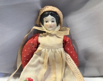 Antique Porcelain Doll: Red Dress, Painted Black Hair, 8-inch Vintage Collectible