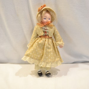 House of Hatten porcelain doll, prairie baby doll, beige dress, bonnet, blonde hair, 8&quot; tall