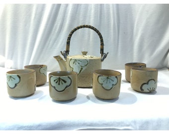 Vintage Japanese stoneware tea set, teapot and six cups, beige with white floral design