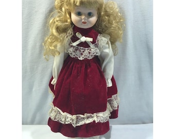 Vintage porcelain doll, red velvet dress, blonde hair blue eyes, 16" tall