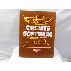 May include: A brown book titled "CIRCUITS and SOFTWARE" with white lettering. The book is for electronics engineers and features a yellow schematic diagram. A technical manual.
