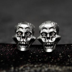 Skull with grass and flower texture, Mexican skull earrings, sterling silver skull earrings, craftsman's exquisite skull earrings