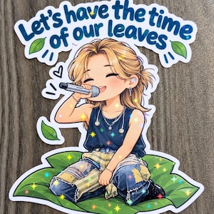 May include: A die-cut sticker featuring an anime-style character with blonde hair singing into a microphone, wearing a dark tank top and patchwork jeans, sitting on a large green leaf with the text Let's have the time of our leaves.