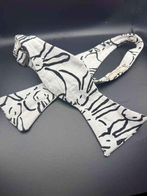 White w/ Black Bunny Outline Self Tie Bow Tie. Silver Hardware. Black Back